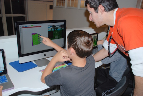 Kids use Scratch program developed by MIT to create and code original games. 