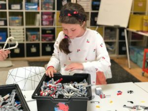 Students learning robotics and engineering in tech camp