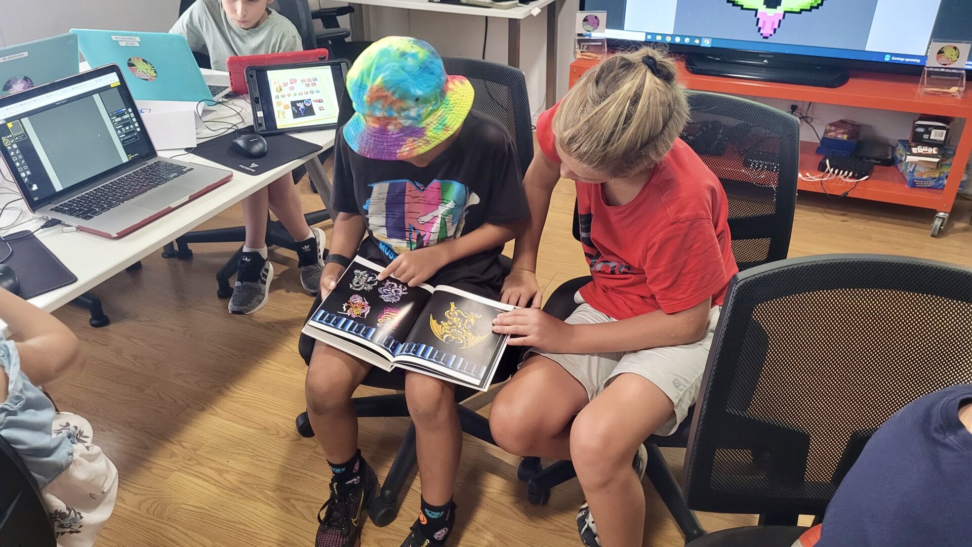 Students learning and communicating together in tech education.